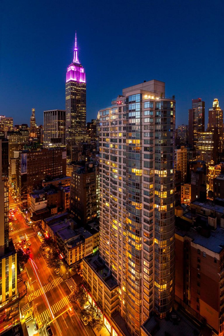 800 6th Buyilding at Night with City Skyline in View